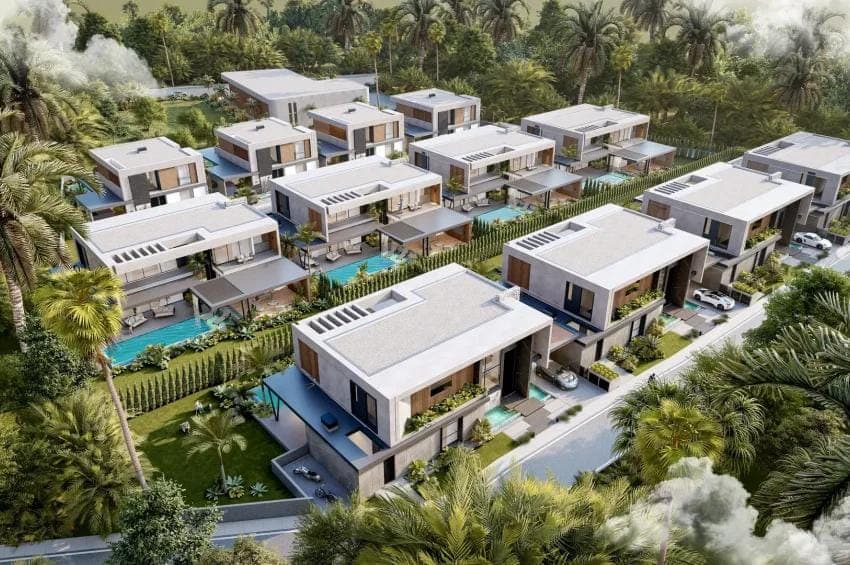 Vue aérienne d’un ensemble de villas contemporaines au milieu de la végétation